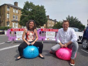Councillor Peter Mason and Councillor Deirdre Costigan joined in the fun by swapping the car for a space hopper at a street in Ealing