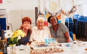 100 year old Charlie with Age UK Ealing day centre managers