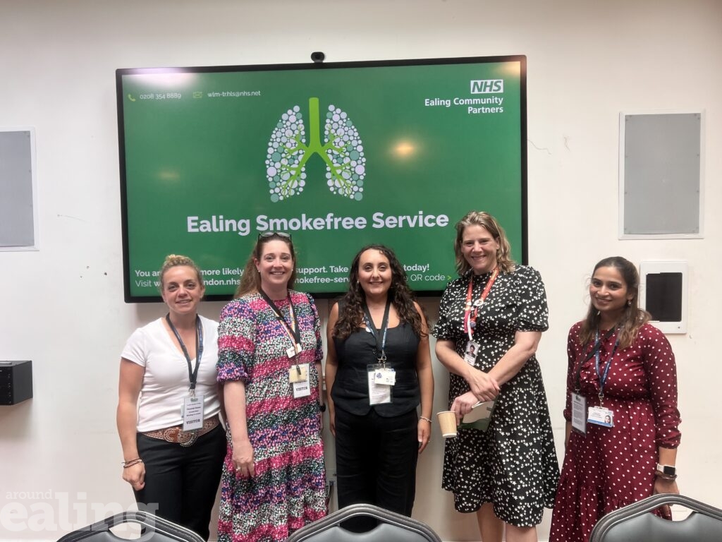 5 women standing in front of a green sign reading Ealing Smokefree Service