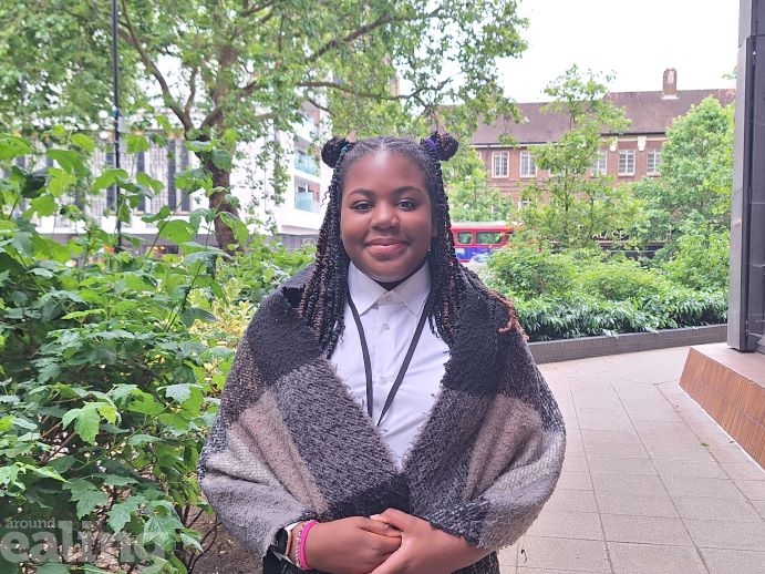 teenage girl standing smiling outside Perceval House