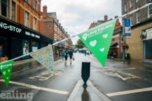 Bond Street closed to cars with green bunting saying love local on it