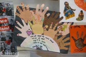 anti-racism artwork by school pupils including cut outs of different coloured hands