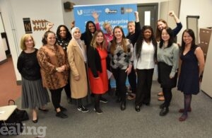 Group of women standing together smiling at business start-up enterprise event