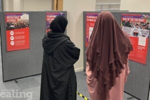 Two muslim women look at islamophobia exhibition