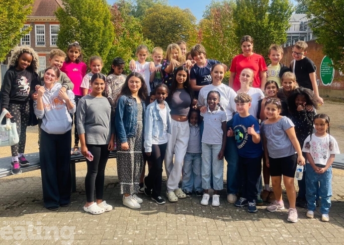 Group of children and adults smiling