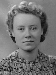 Woman looking at the camera in old photograph from 1940