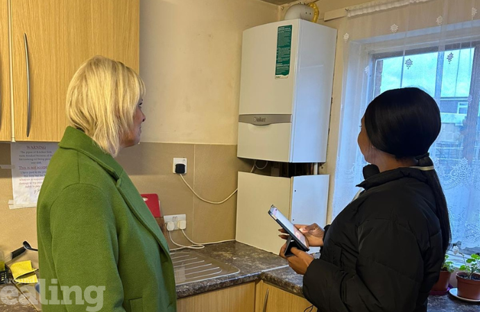 Two women stood in kitchen during HMO inspection