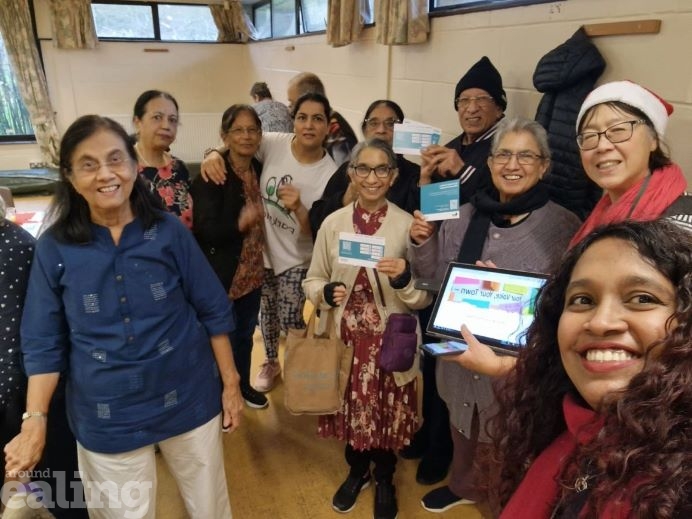 A group of people from an exercise class in Perivale meeting the Your Voice, Your Town team.