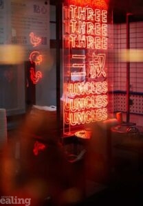 neon Three Uncles window sign