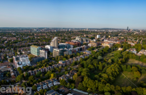 Aerial view of Ealing town featuring tops of buildings. Ealing Council has appointed some leading planning, sustainability, and urban design experts to play a lead role in what is already one of the best planning authorities in the country.