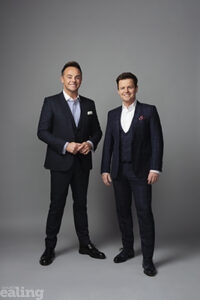 Two men wearing suits, standing up. Ant and Dec from TV