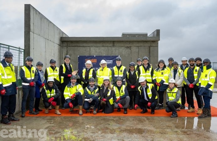 Councillors, council staff and Hill Group celebrating new homes