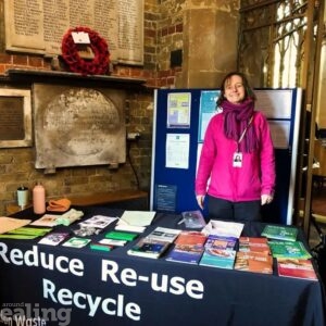 Council staff stood behind a stall with flyers at St Marys Church