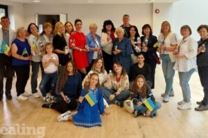 group of people holding traditional Ukrainian symbols of good luck