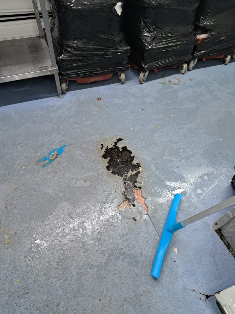 Dirty and damaged floor at Bread Spread factory