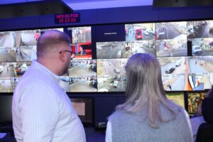 Jason Hawes showing Cllr Jasbir Anand the council's CCTV room