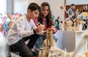 Two children building a structure at RIBA event for aspiring architects